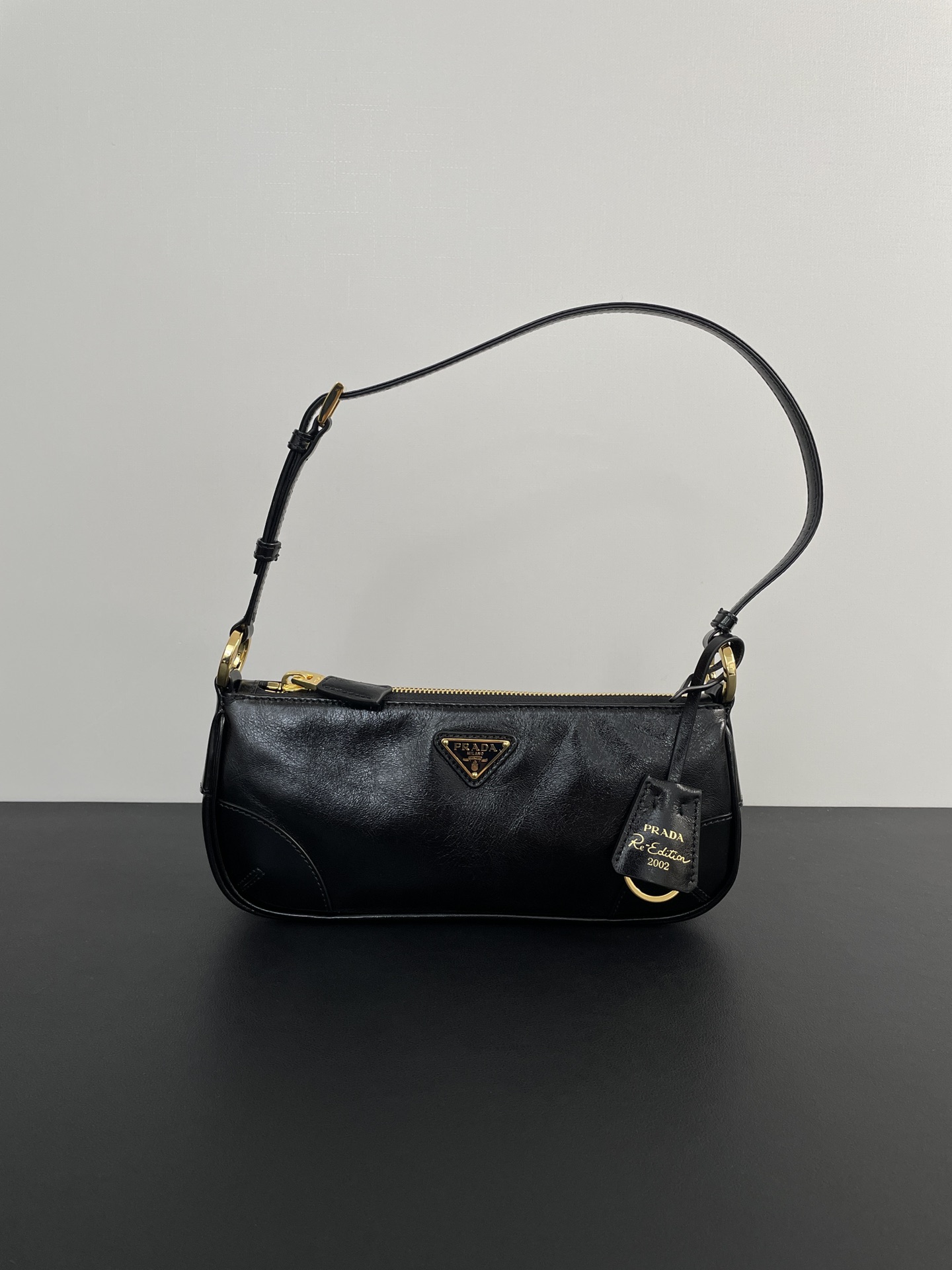 PRADA Re-Edition 2002 small leather shoulder bag Black/Gold Hardware