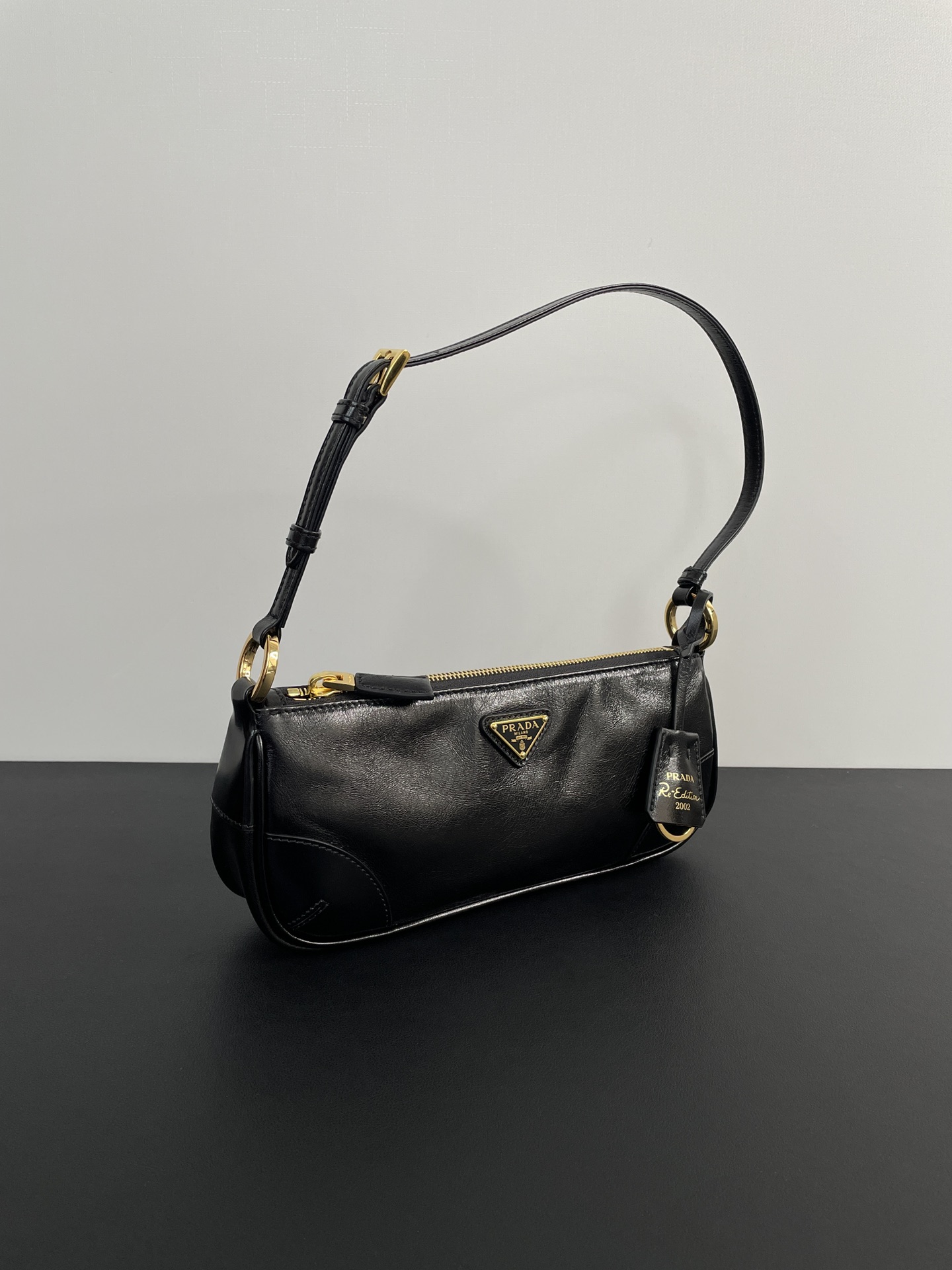 PRADA Re-Edition 2002 small leather shoulder bag Black/Gold Hardware