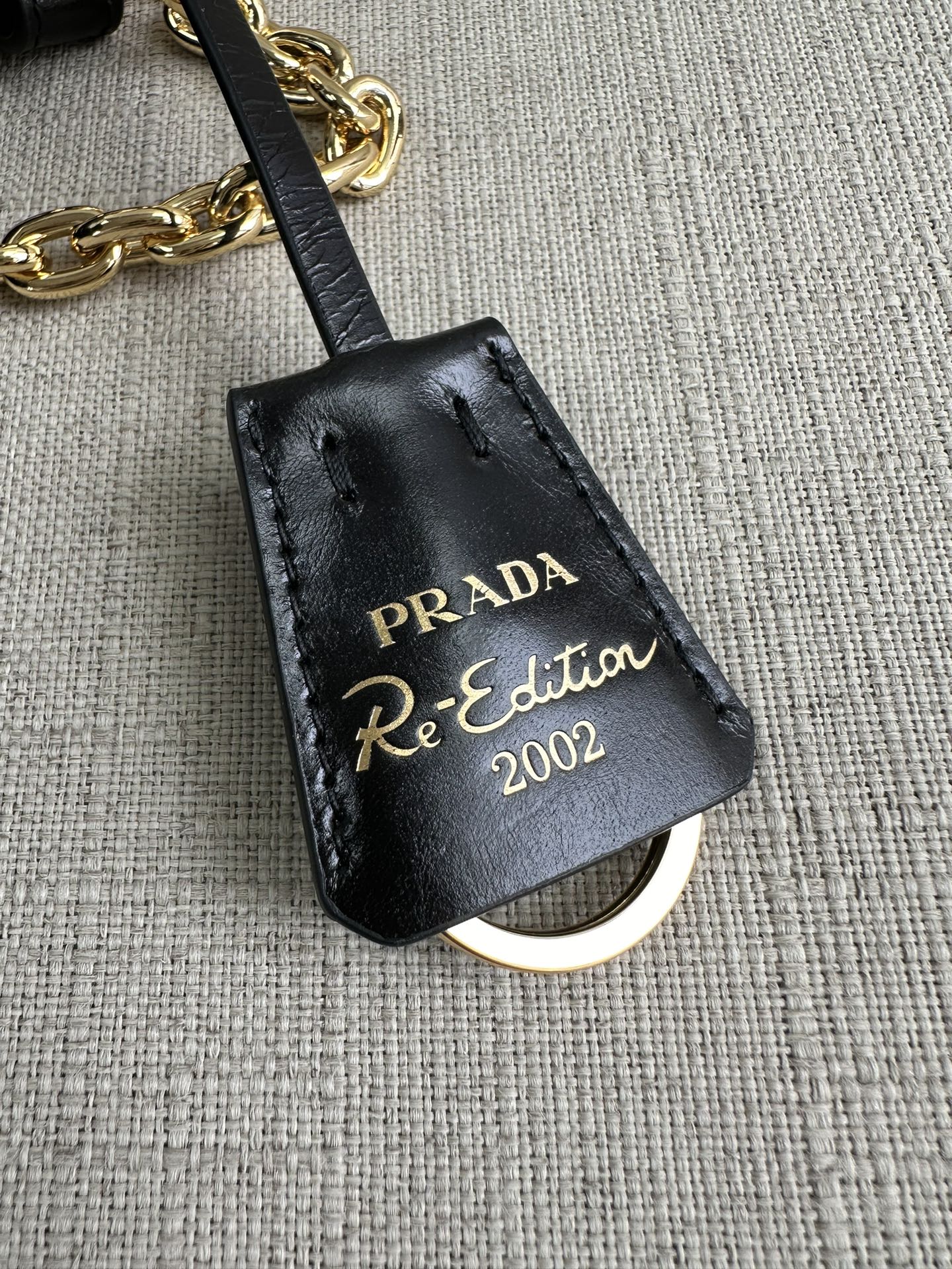 PRADA Re-Edition 2002 medium leather shoulder bag Black/Gold Hardware